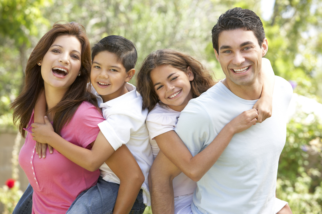 Portrait of Happy Family In Park